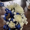 Small bouquet of white roses with blue ribbon and baby's breath