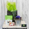 Send warm wishes with this gift filled with a blooming African Violet