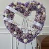 Various lavender flowers lined with a pleated lavender ribbon. 