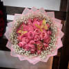 A sweet halo of tightly packed pink roses creates an immediate "aww"