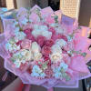 A lush, full-bodied bouquet of pink and white roses that reads as