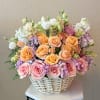 With its dreamy palette of blush, soft peach, and vibrant pink tones