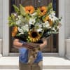 Bring warmth and elegance to any occasion with this beautifully handcrafted bouquet.