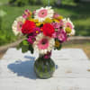 Brighten someone's day with this energetic and colorful floral arrangement.Perfectly arranged in