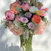 Mixed pastel bouquet in a clear glass vase