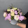 A mixed design of local lavender dahlias and lush orchids.

Our "What&rsquo;s in