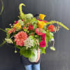 A weekly seasonal arrangement that showcases seasonal zinnias, dahlias, queen annes lace