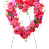 A bold heart formed from tightly clustered pink, red, and purple blooms