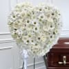 Express your deepest condolences with a beautifully handcrafted heart-shaped standing sympathy wreath