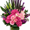 A luxurious arrangement featuring vibrant pink hydrangeas, soft blush roses, elegant lilies