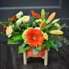 A bold orange gerbera takes center stage in this Sizzlin' Summer Blooms
