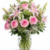 Soft, elegant, and timeless, this beautiful bouquet features delicate pink roses, fragrant