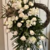 Tall white floral standing spray with roses and lilies