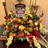 REDS, GREENS, YELLOWS AND ORANGE FLOWERS AND FILLER FLOWERS WITH ASSORTED GREENS
