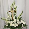 White floral arrangement with a wooden cross centerpiece