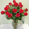 Bouquet of red roses in a clear glass vase