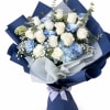 A sophisticated bouquet featuring premium white roses, soft blue carnations, hydrangea, baby&rsquo;s
