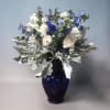 An array of whites and blues accented by dusty miller or eucalyptus.