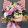 Pink and white mixed bouquet wrapped in pink and gold paper