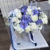 Blue and white bouquet with roses and orchids in a hatbox