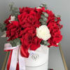 Bouquet of red and white roses with eucalyptus in a white hat box