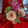 Pink and white mixed bouquet in a small heart-decorated vase