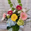 Colorful mixed flower arrangement in a glass vase