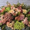 Large mixed bouquet with pink, peach, and green flowers