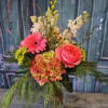 Pink gerbera and rose arrangement in a glass vase