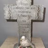 Decorative memorial cross with a bird and flowers