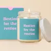 Lit candle in a glass jar with a matching box and lid