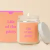 Glass candle jar with a peach label and matching box