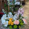 Radiating grace and serenity, this bouquet surround keepsake with colorful florals.
This arrangement