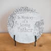 Round memorial plaque reading 