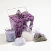 Purple floral gift box with lavender candle, soaps, and scented sachet bags
