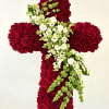 An exquisite standing cross of lush red roses accented with cascading white