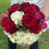 Bouquet of red roses with white hydrangeas and pink rosebuds