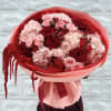 Bouquet of red and pink roses with hydrangeas wrapped in pink paper