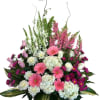 Pink and white mixed flower arrangement in a basket