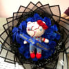 Bouquet with blue roses and a plush doll in the center