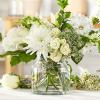 White flowers arranged in a clear glass vase