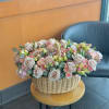 large flower arrangement with roses and lisianthus