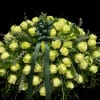 Large bouquet of pale yellow roses with a dark green ribbon