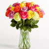 Colorful roses arranged in a clear glass vase