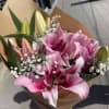 Beautiful pink lilies arranged in 4 stems with delicate Korean paper and