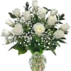 White rose bouquet in a clear glass vase