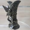 Tall dark metal decorative vase with ornate fairy relief and gothic motif