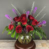 Stunning red roses and purple liatris in a bubble vase. Show your