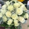 Bouquet of white roses with baby's breath and greenery