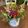 A bucket full of a mixture of different flowers. *Please note that